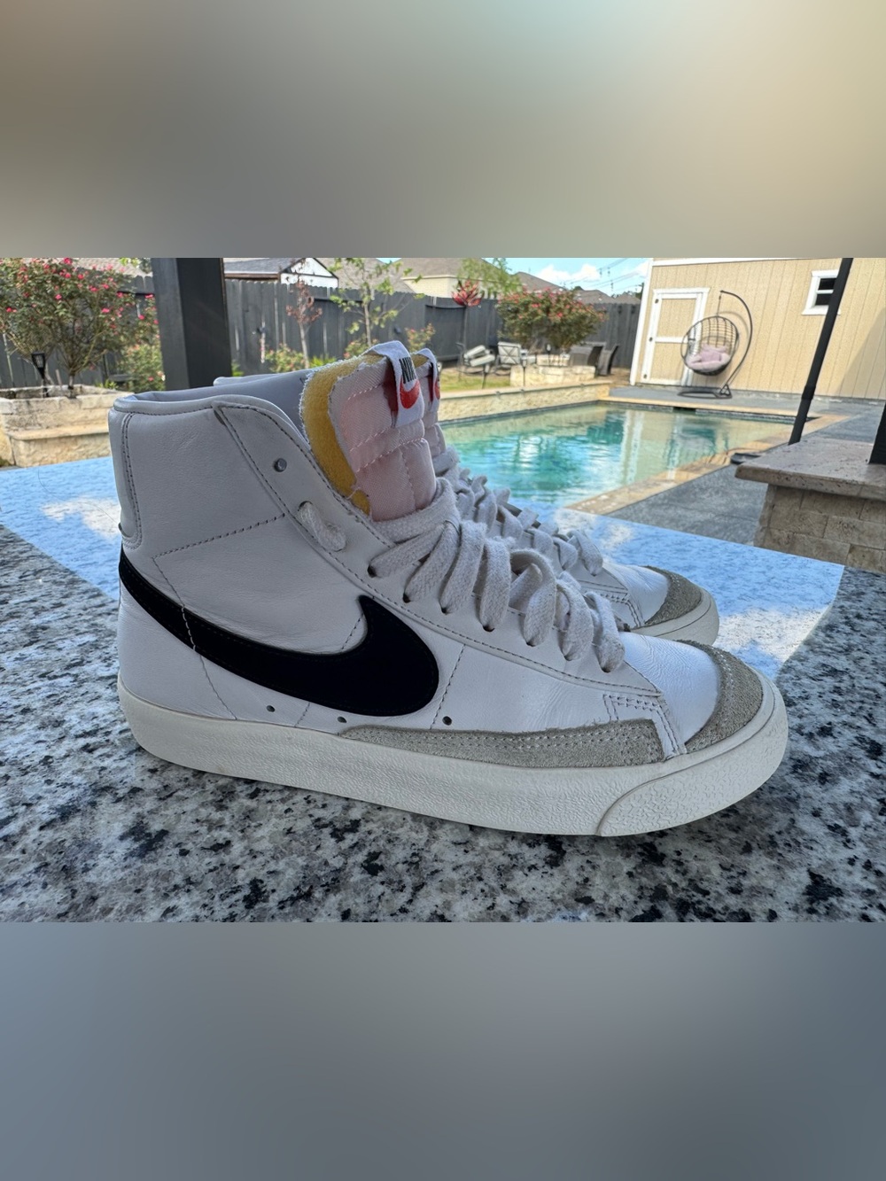 Nike White High-Top Sneakers with Black Swoosh and Yellow Tongue Detail